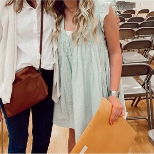 Green dress with floral embroidery